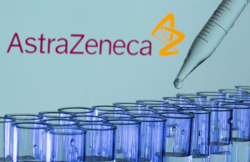 FILE PHOTO: FILE PHOTO: Test tubes are seen in front of a displayed AstraZeneca logo in this illustration