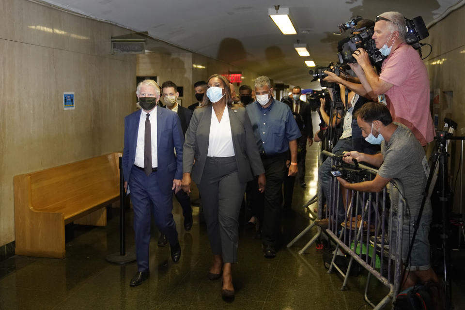Manhattan District Attorney, Cyrus Vance, Jr., left, and the Attorney General of New York Letitia James, second from left, arrive to a courtroom in New York, Thursday, July 1, 2021. Donald Trump’s company and its longtime finance chief were charged Thursday in what a prosecutor called a “sweeping and audacious” tax fraud scheme that saw the Trump executive allegedly receive more than $1.7 million in off-the-books compensation, including apartment rent, car payments and school tuition. (AP Photo/Seth Wenig)