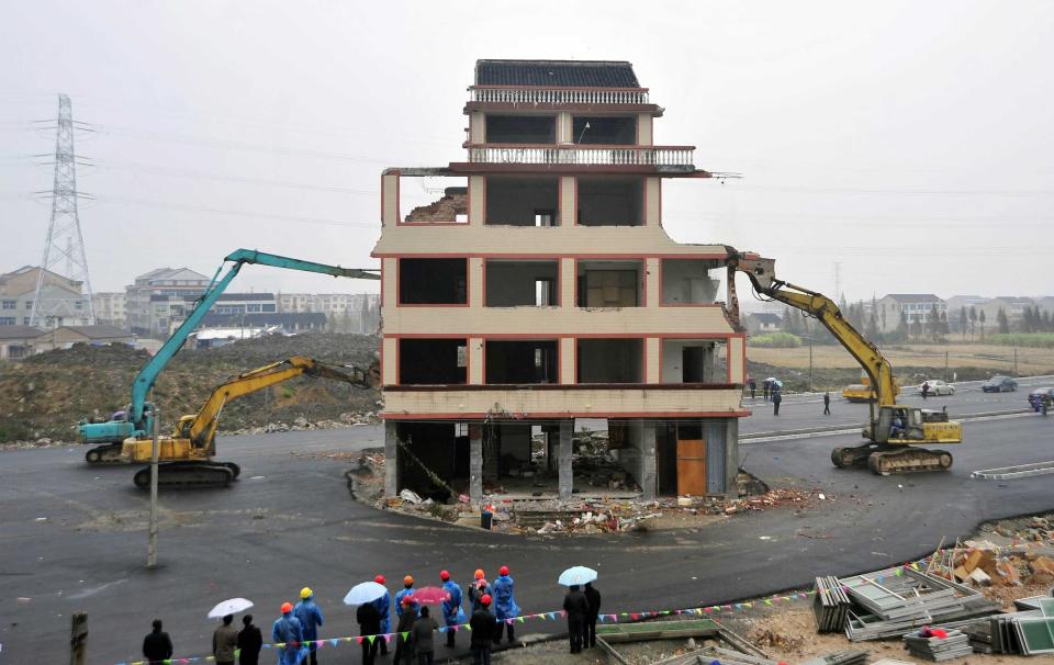 The remarkable house has finally been demolished after Luo Baogen accepted the compensation offered by the local government (Rex)