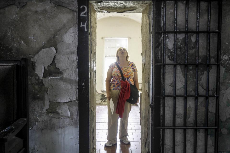 Alberta Chulick of St. Louis looks at an old cell during a tour of the Missouri State Penitentiary in Jefferson City