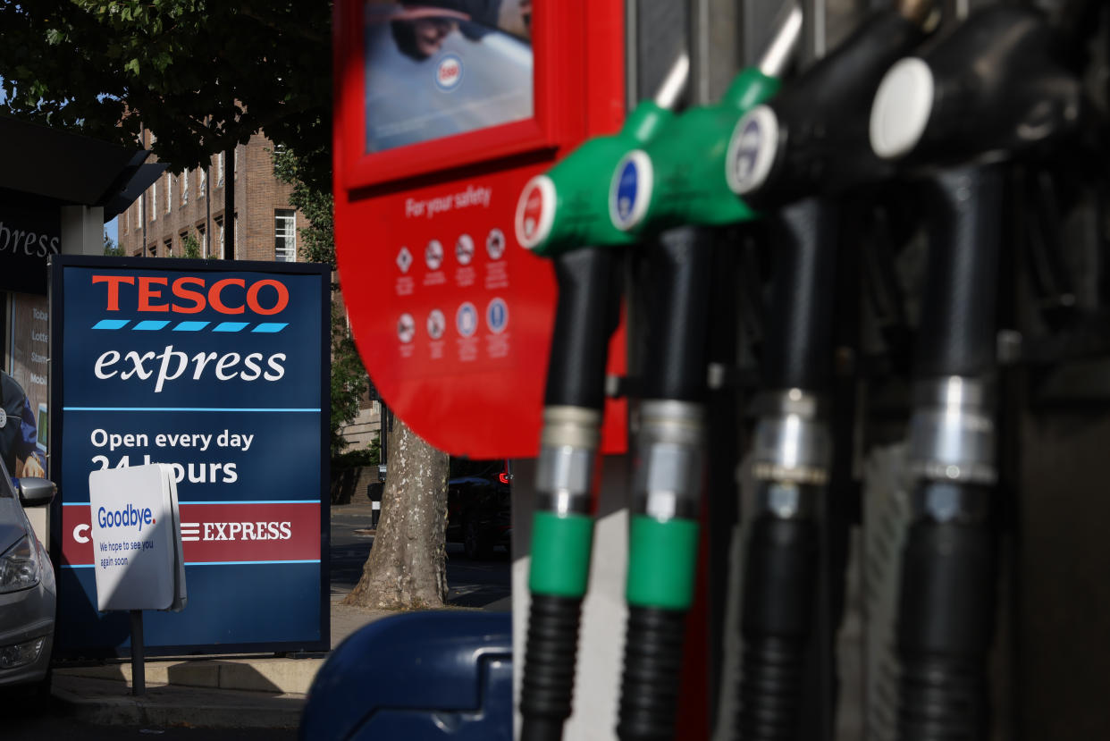 LONDON, ENGLAND - JULY 24: Fuel pumps at an Esso Tesco petrol station on July 24, 2022 in London, England. Many Supermarket Fuel Stations are still charging high prices on the forecourt despite wholesale prices coming down over the last few weeks. (Photo by Hollie Adams/Getty Images)