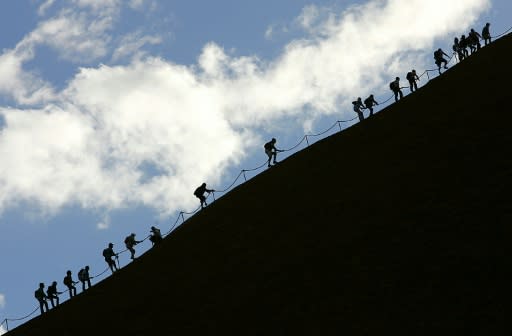 For years there have been signs at the base of the rock imploring visitors not to climb, but they were not often heeded