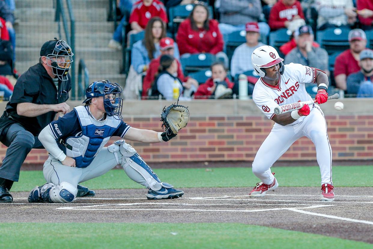 Oklahoma outfielder Kendall Pettis (7) bunts the ball during an NCAA baseball game between Oklahoma (OU) and Dallas Baptist (DBU) in Norman, Okla., on Tuesday, March 19, 2024.