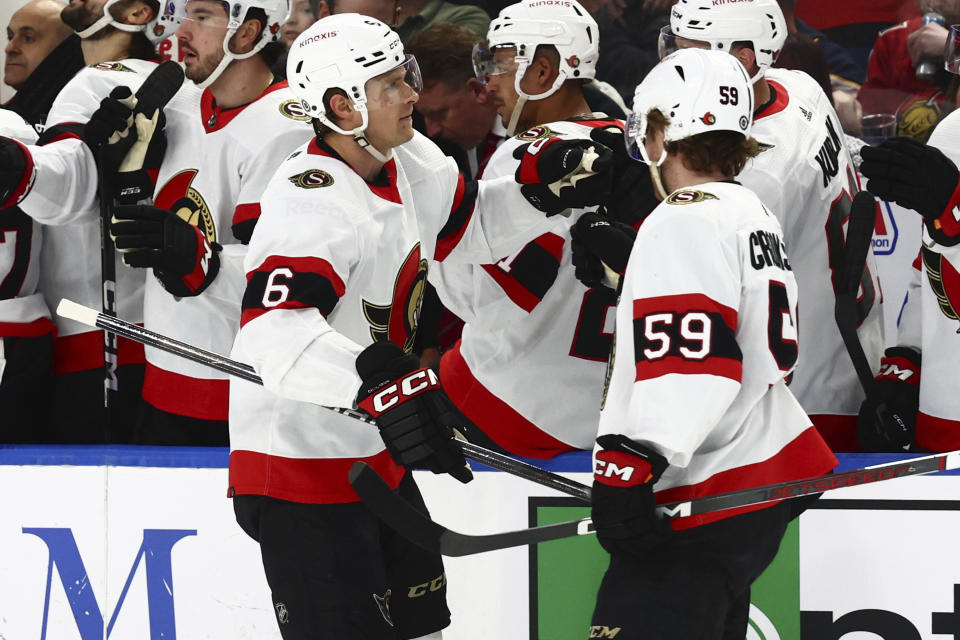 Ottawa Senators defenseman Jakob Chychrun (6) celebrates his goal with left wing Angus Crookshank (59) during the first period of an NHL hockey against the Buffalo Sabres game Wednesday, March 27, 2024, in Buffalo, N.Y. (AP Photo/Jeffrey T. Barnes)