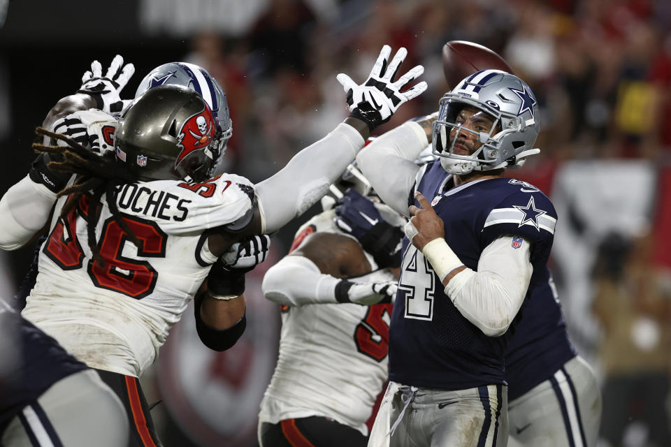 Dallas Cowboys quarterback Dak Prescott (4) is pressured by Tampa Bay Buccaneers defensive tackle Rakeem Nunez-Roches (56) during the second half of an NFL football game Thursday, Sept. 9, 2021, in Tampa, Fla. (AP Photo/Mark LoMoglio)