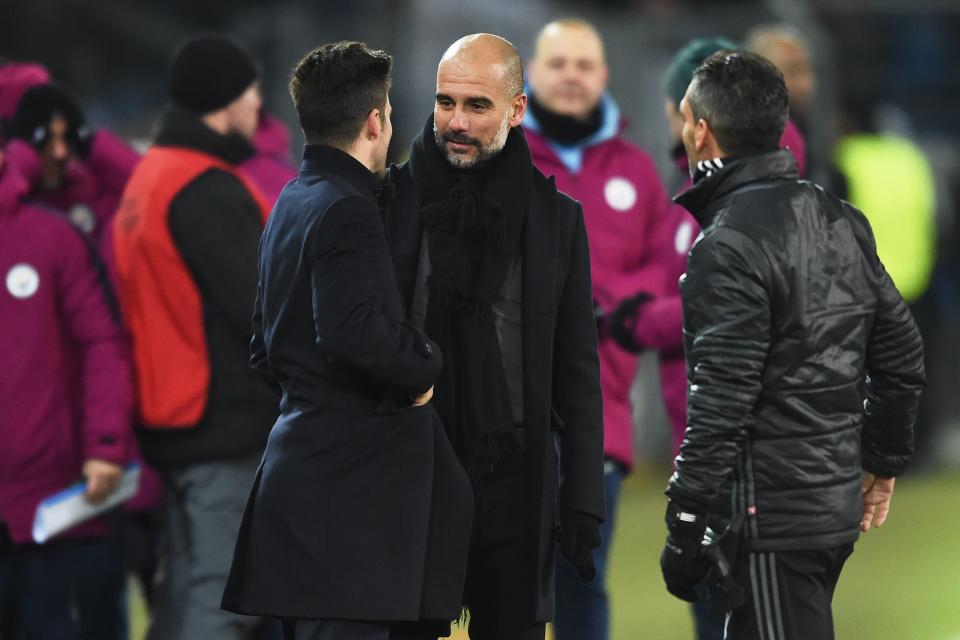 Wicky shares a moment with Manchester City manager Pep Guardiola (center) after City and Basel met in the UEFA Champions League round of 16 last March. (Sebastien Bozon/Getty)