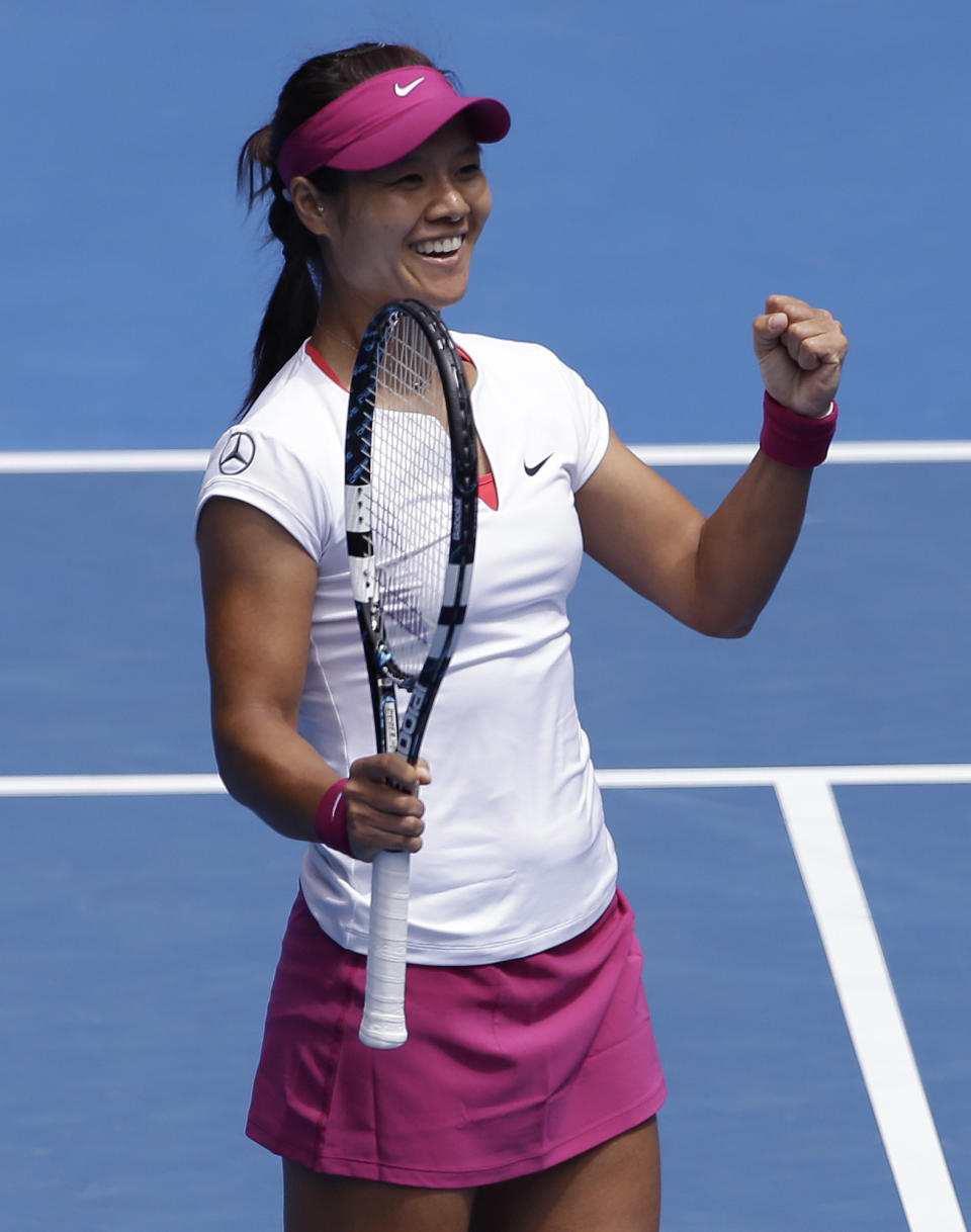 Li Na of China celebrates after defeating Flavia Pennetta of Italy during their quarterfinal at the Australian Open tennis championship in Melbourne, Australia, Tuesday, Jan. 21, 2014.(AP Photo/Aijaz Rahi)