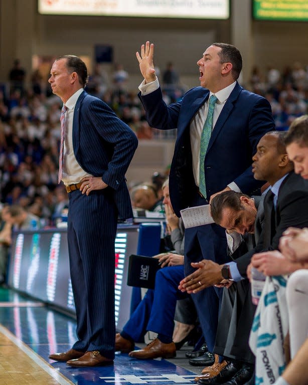 The style of first-year FGCU coach Michael Fly (hand raised) will be much different than that of Joe Dooley (left), who is at East Carolina after five seasons with the Eagles.