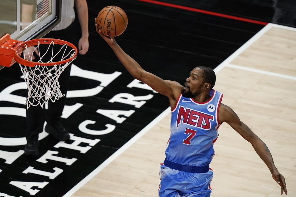 Brooklyn Nets forward Kevin Durant scores against the Atlanta Hawks during the second half of an NBA basketball game Wednesday, Jan. 27, 2021, in Atlanta. (AP Photo/Brynn Anderson)