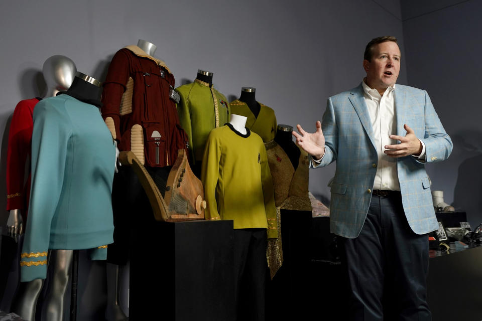 Joshua Benesh, Heritage Auction's chief strategy officer, talks to reporters about Greg Jein's work and collection, Thursday, Aug. 30, 2023, in Irving, Texas. While Greg Jein's work over nearly half a century making miniature models in Hollywood included such iconic creations as the alien mothership in 