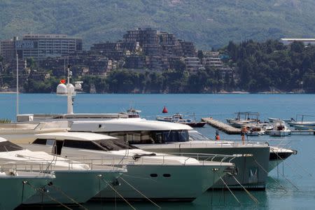 Newly-built real estate is seen behind luxury yachts in Budva, Montenegro, May 15, 2017. REUTERS/Stevo Vasiljevic