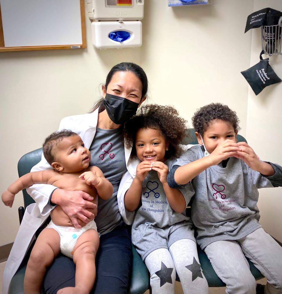 Dr. Reiko Johnson with a  few of her young patients.