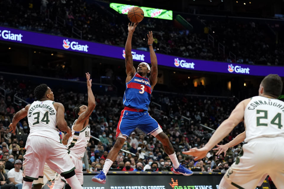 Washington Wizards guard Bradley Beal (3) shoots in the second half of an NBA basketball game against the Milwaukee Bucks, Sunday, Nov. 7, 2021, in Washington. Beal contributed a game-high 30 points to Washington's 101-94 win. (AP Photo/Patrick Semansky)