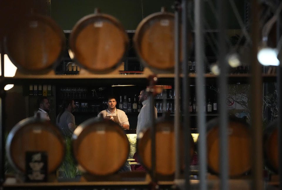 Barrels of brandy are shown in the bar in Belgrade, Serbia, Friday, Nov. 11, 2022. The U.N.'s culture and education organization is set later this month to review Serbia's bid to include "social practices and knowledge related to the preparation and use of the traditional plum spirit - sljivovica" on the list of world intangible cultural heritage. (AP Photo/Darko Vojinovic)