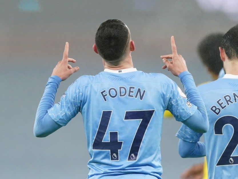 Phil Foden celebrates scoring against Man CityManchester City FC via Getty Images