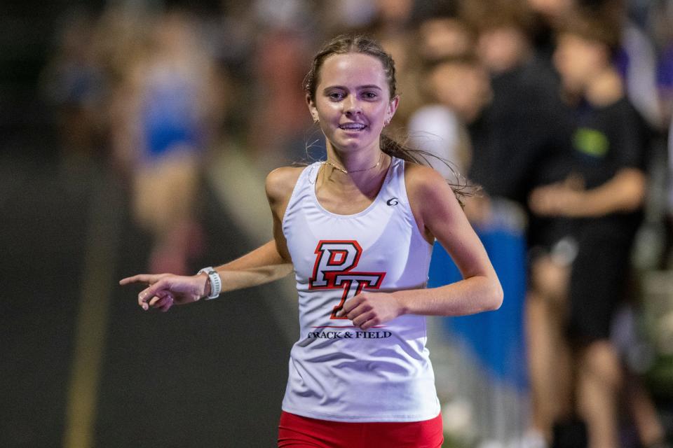 Park Tudor High School’s Sophia Kennedy reacts as she crosses the finish line during a Flashes Showcase Miracle Mile race, Friday, April 14, 2023, at Franklin Central High School in Indianapolis.
