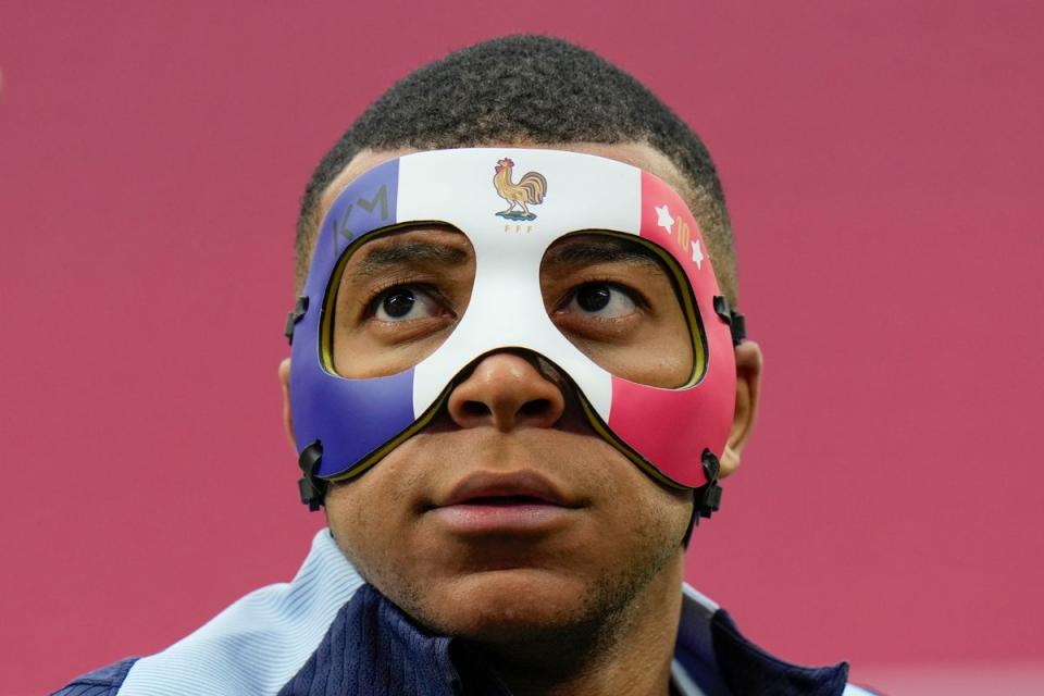 The France striker in a custom-made mask during training (AP)