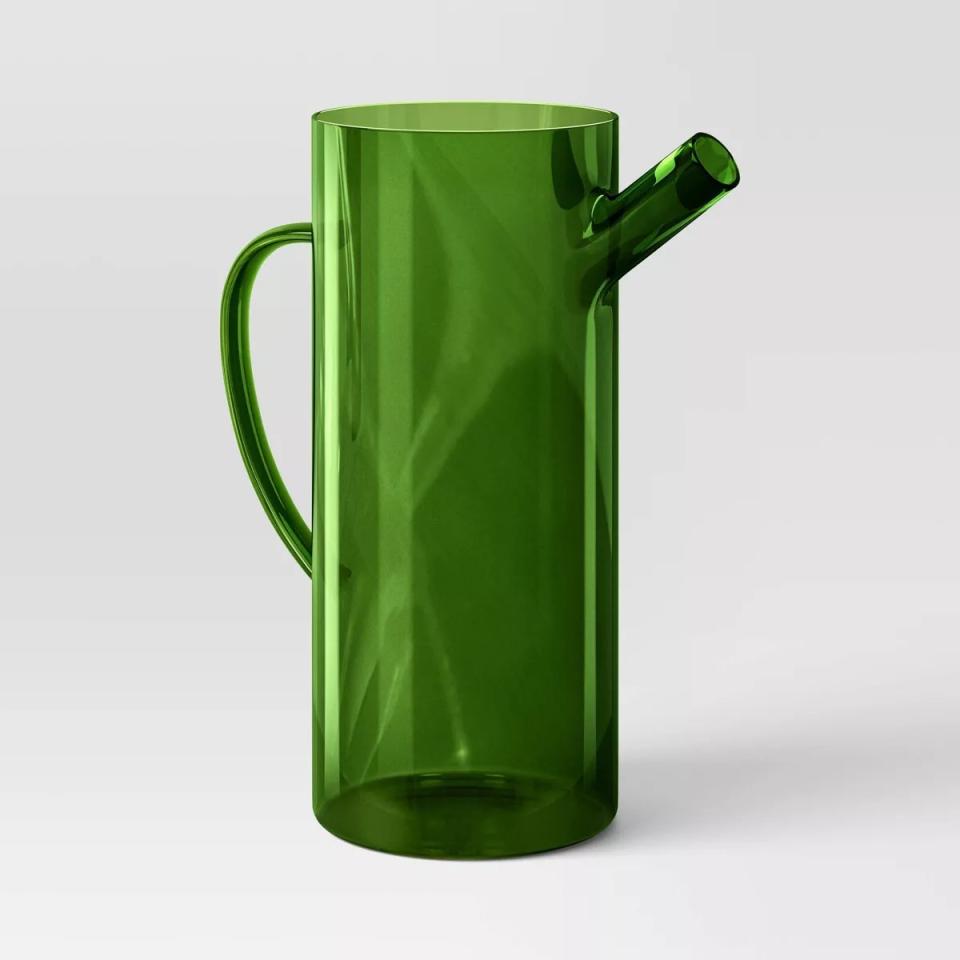 Green glass watering can