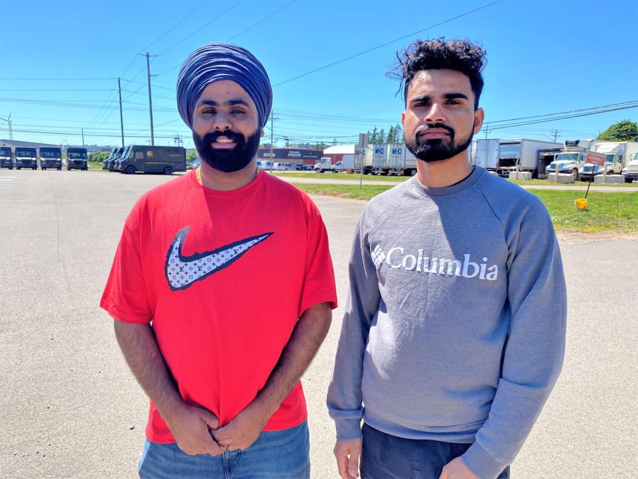 Maavi Gill, left, and Manpreet Sing were just home from work when Singh smelled something burning. (Victoria Walton/CBC - image credit)