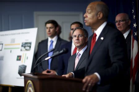 U.S. Attorney for New Jersey Paul J. Fishman (C) looks at Secretary of Homeland Security Jeh Johnson while he speaks during a news conference in Newark, New Jersey August 11, 2015. REUTERS/Eduardo Munoz