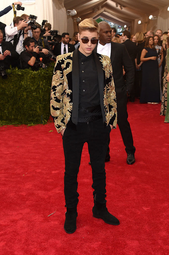 Justin wore an embroidered jacket with matching shirt and pants, as well as sunglasses