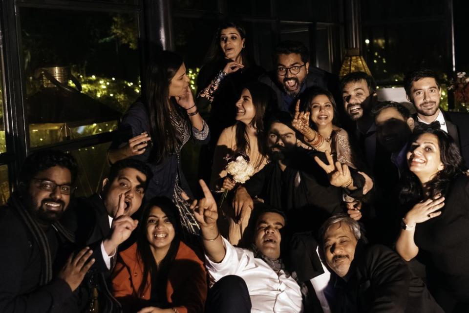 Full team who put together Virushka’s dream wedding. Devika Narain in red jacket & Joseph Radhik right above Anushka’s left shoulder