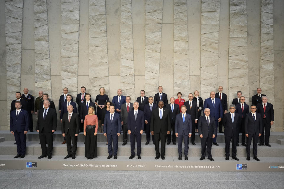 Defense ministers and ambassadors pose for a group photo during a meeting of NATO defense ministers at NATO headquarters in Brussels, Thursday, Oct. 12, 2023. (AP Photo/Virginia Mayo)