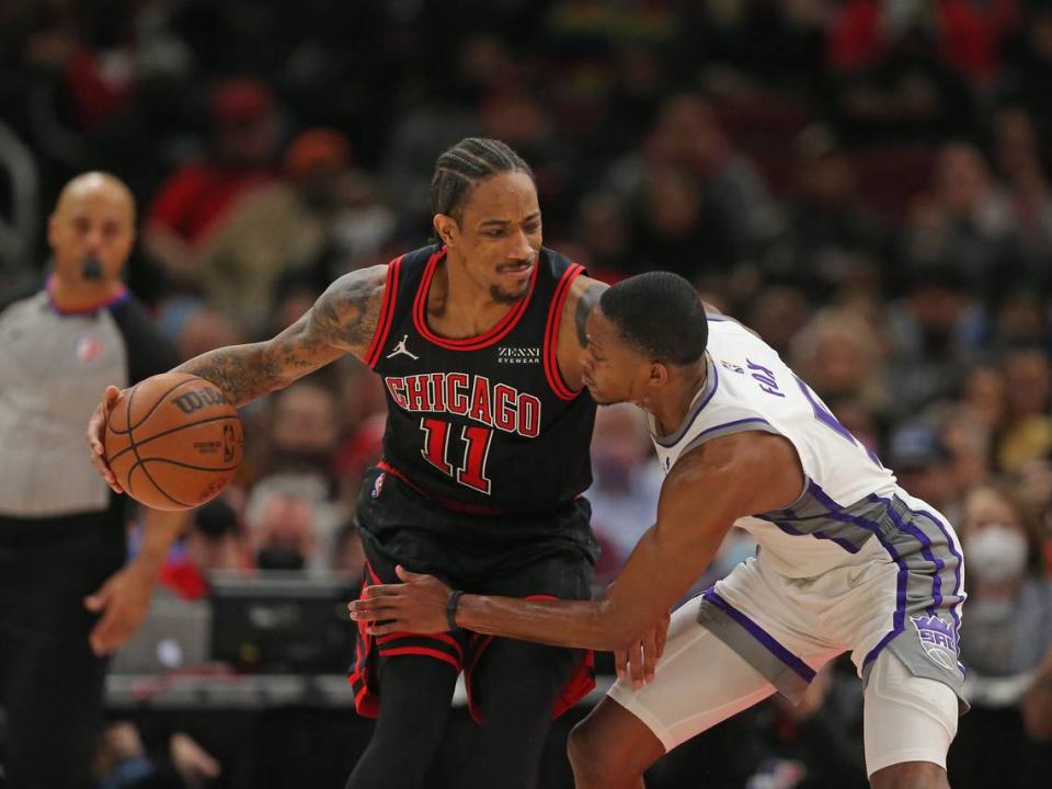 Chicago Bulls forward DeMar DeRozan (11) is defended by Sacramento Kings guard De’Aaron Fox (5) during the second half Feb. 16, 2022, at the United Center in Chicago, Illinois.