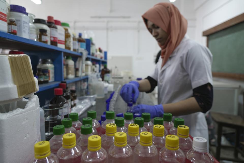 Lab workers conduct tests at the Chemical Oceanography lab at Cochin University of Science and Technology in Eloor, Kerala state, India, Friday, March 3, 2023. Trainees with the Pollution Control Board do daily trips to collect samples from six different points along the Periyar River. (AP Photo)