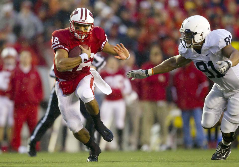 Nov 26, 2011; Madison, WI, USA; Wisconsin Badgers quarterback <a class="link " href="https://sports.yahoo.com/nfl/players/25785" data-i13n="sec:content-canvas;subsec:anchor_text;elm:context_link" data-ylk="slk:Russell Wilson;sec:content-canvas;subsec:anchor_text;elm:context_link;itc:0">Russell Wilson</a> (16) rushes with the football during the second quarter against the Penn State Nittany Lions at Camp Randall Stadium. Mandatory Credit: Jeff Hanisch-USA TODAY Sports