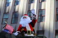 <p>Santa Claus waves to spectators during the Veterans Day parade on Fifth Avenue in New York on Nov. 11, 2017. (Photo: Gordon Donovan/Yahoo News) </p>