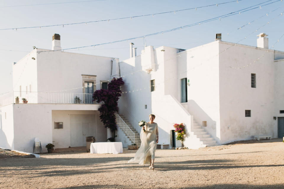 The bride wore a gown from Larimeloom, a local Italian designer.