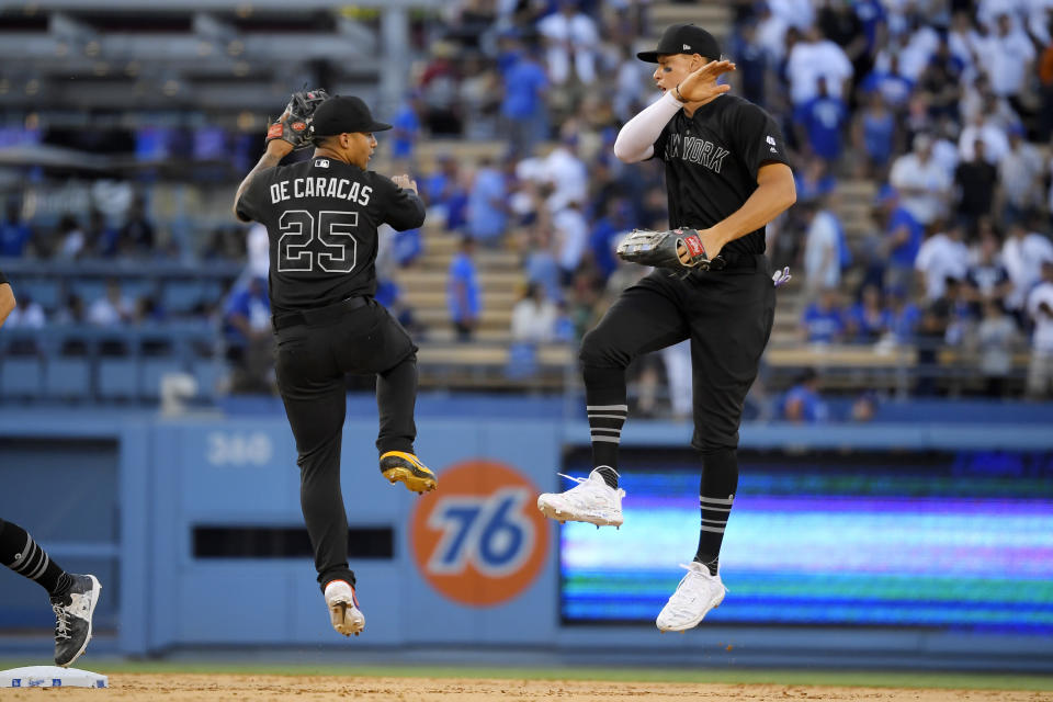 New York Yankees' Gleyber Torres, left, celebrates with Aaron Judge after the Yankees defeated the Los Angeles Dodgers 5-1 in a baseball game, Sunday, Aug. 25, 2019, in Los Angeles. (AP Photo/Mark J. Terrill)