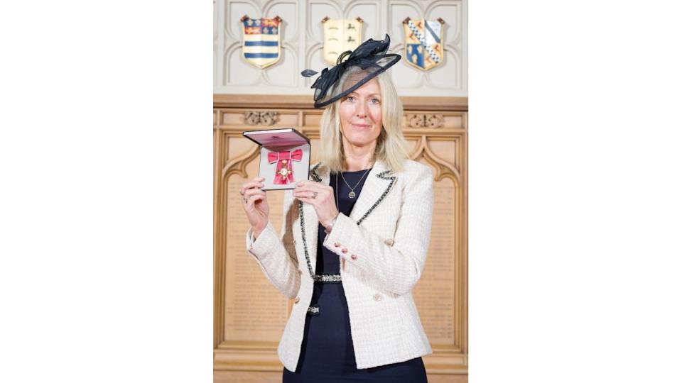 Rachel Watkyn posing with her OBE for Services to Sustainability
