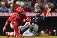 Minnesota Twins' Alex Kirilloff, right, slides home past Los Angeles Angels catcher Matt Thaiss to score on a double by Edouard Julien during the seventh inning of a baseball game Saturday, April 27, 2024, in Anaheim, Calif. (AP Photo/Ryan Sun)