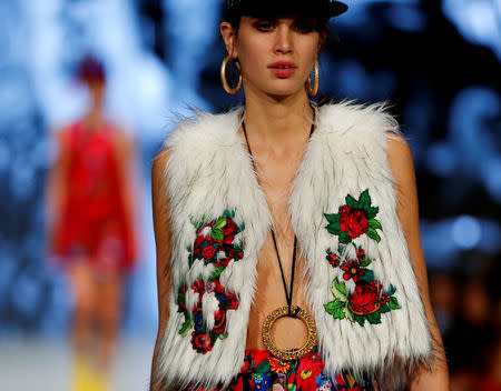 A model dressed in Romani Design clothes walks the catwalk at a fashion show in Budapest, Hungary, November 12, 2016. REUTERS/Laszlo Balogh