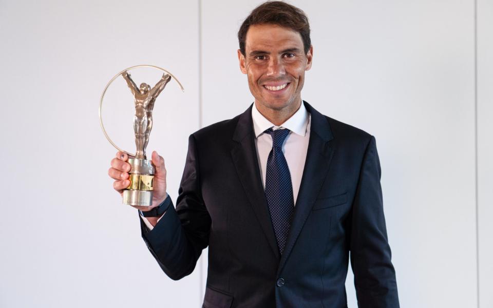 Nadal with his Laureus world sportsman of the year award for 2021