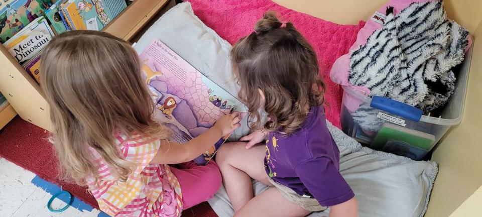 Students read a book at Calvary Lutheran Learning Center in Topeka. The center’s director is currently working to expand the center so she can serve infants as well as older toddlers.