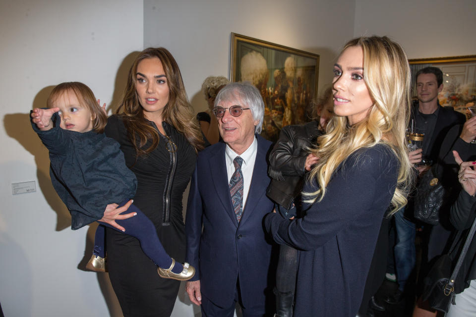 Tamara Ecclestone with daughter Sophia Ecclestone-Rutland, father Bernie Ecclestone and Petra Stunt with daughter Lavinia Stunt  attend the private view of Tyler Shields: Decadence at Maddox Gallery on February 3, 2016 in London, England.  (Photo by Luca Teuchmann/Getty Images)