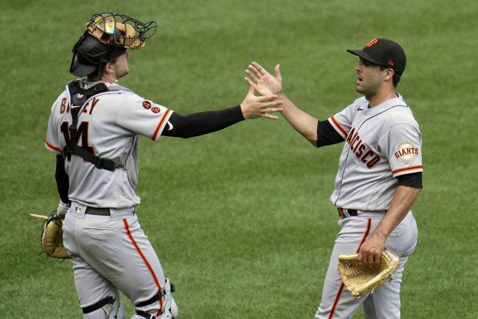 San Francisco Giants relief pitcher Scott Alexander, right, celebrates with catcher Patrick Bailey after getting the final out in an 8-4 win over the Pittsburgh Pirates in a baseball game in Pittsburgh, Sunday, July 16, 2023. (AP Photo/Gene J. Puskar)