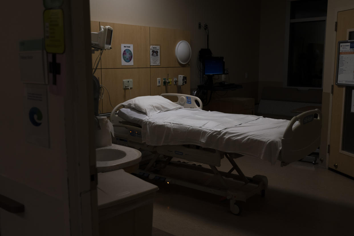An empty bed is seen after a COVID-19 patient was transferred to an intensive care unit at Providence Holy Cross Medical Center in Los Angeles, Monday, Dec. 13, 2021. (AP Photo/Jae C. Hong)