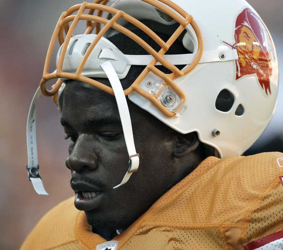 FILE - Tampa Bay Buccaneers linebacker Geno Hayes is shown during an NFL football game against the Atlanta Falcons in Tampa, Fla., in this Sunday, Dec. 5, 2010, file photo. Hayes, a former NFL linebacker who starred at Florida State, has died. He was 33. The Tampa Bay Buccaneers on Tuesday, April 27, 2021, confirmed his death. He had liver disease and had been in hospice care. (AP Photo/Chris O'Meara, File)