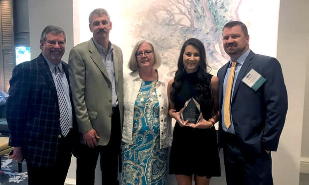 Attorney Jeff Lasky (from left), Dan Ganser, Lisa Ganser, Cayla Ganser (holding the Nestlehut award) and attorney Brian Cornwell. (Photo: John Disney/ALM)