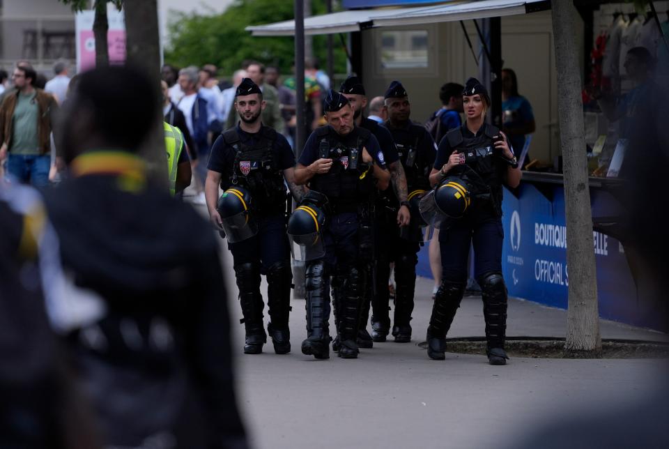 Police and security patrol outside before a soccer match between Mali and Israel on Wednesday at the Olympic Summer Games in Paris.