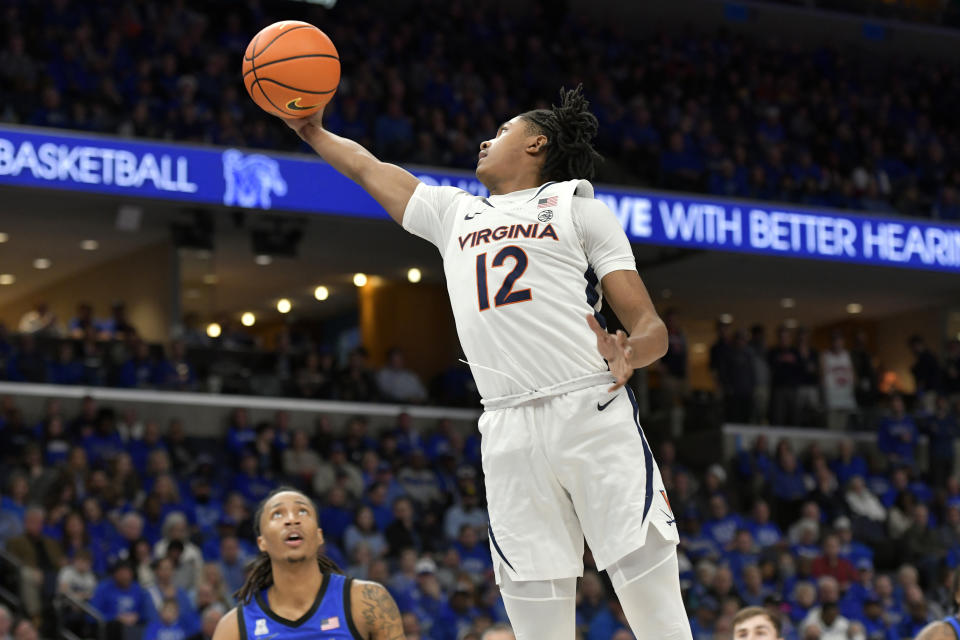 Virginia guard Elijah Gertrude (12) grabs a rebound against Memphis during the first half of an NCAA college basketball game Tuesday, Dec. 19, 2023, in Memphis, Tenn. (AP Photo/Brandon Dill)