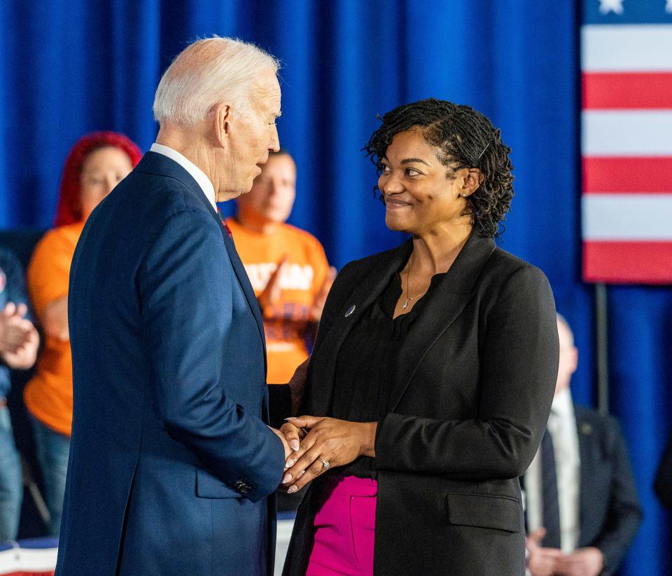 Raynetta Hill, executive director of Historic King Drive Business Improvement District No. 8, greets President Joe Biden at the Pieper-Hillside Boys & Girls Club on Wednesday in Milwaukee.