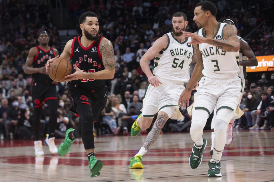 Toronto Raptors' Fred VanVleet drives against Milwaukee Bucks' George Hill (3) during the second half of an NBA basketball game Thursday, Dec. 2, 2021, in Toronto. (Chris Young/The Canadian Press via AP)