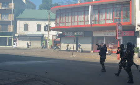 Riot police fire tear gas canisters disperse opposition demonstrators protesting against new electoral laws in Antananarivo, Madagascar April 21, 2018. REUTERS/Clarel Faniry Rasoanaivo