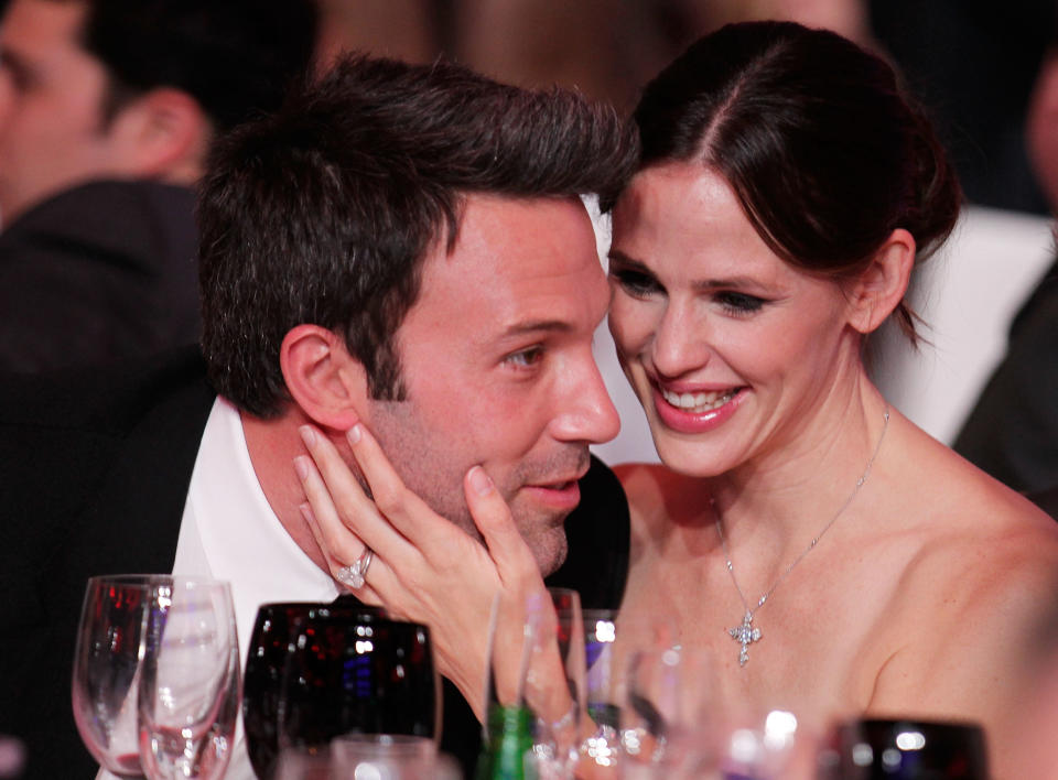 Garner holds Affleck's face