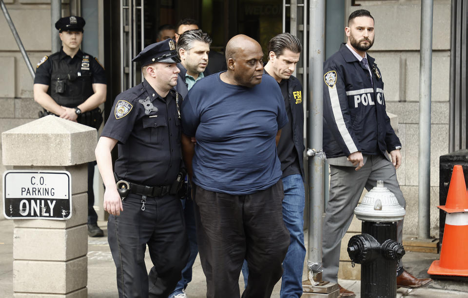 Suspected subway shooter, Frank James is escorted out by the FBI and NYPD officers from the 9th Precinct after having been arrested for his role in the attack at the 36th St subway station in Brooklyn on April 13, 2022 in New York City. James allegedly shot 10 people and set off a smoke device on an N subway train during rush hour. - Credit: John Lamparski/Getty Images